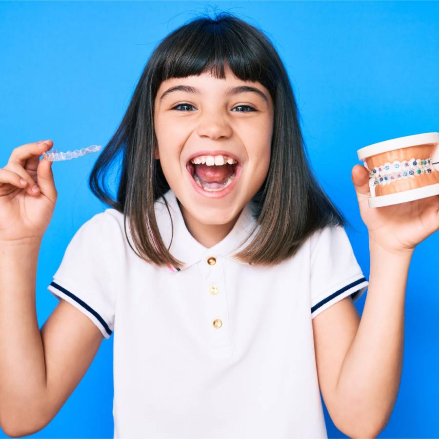 child smiling with braces